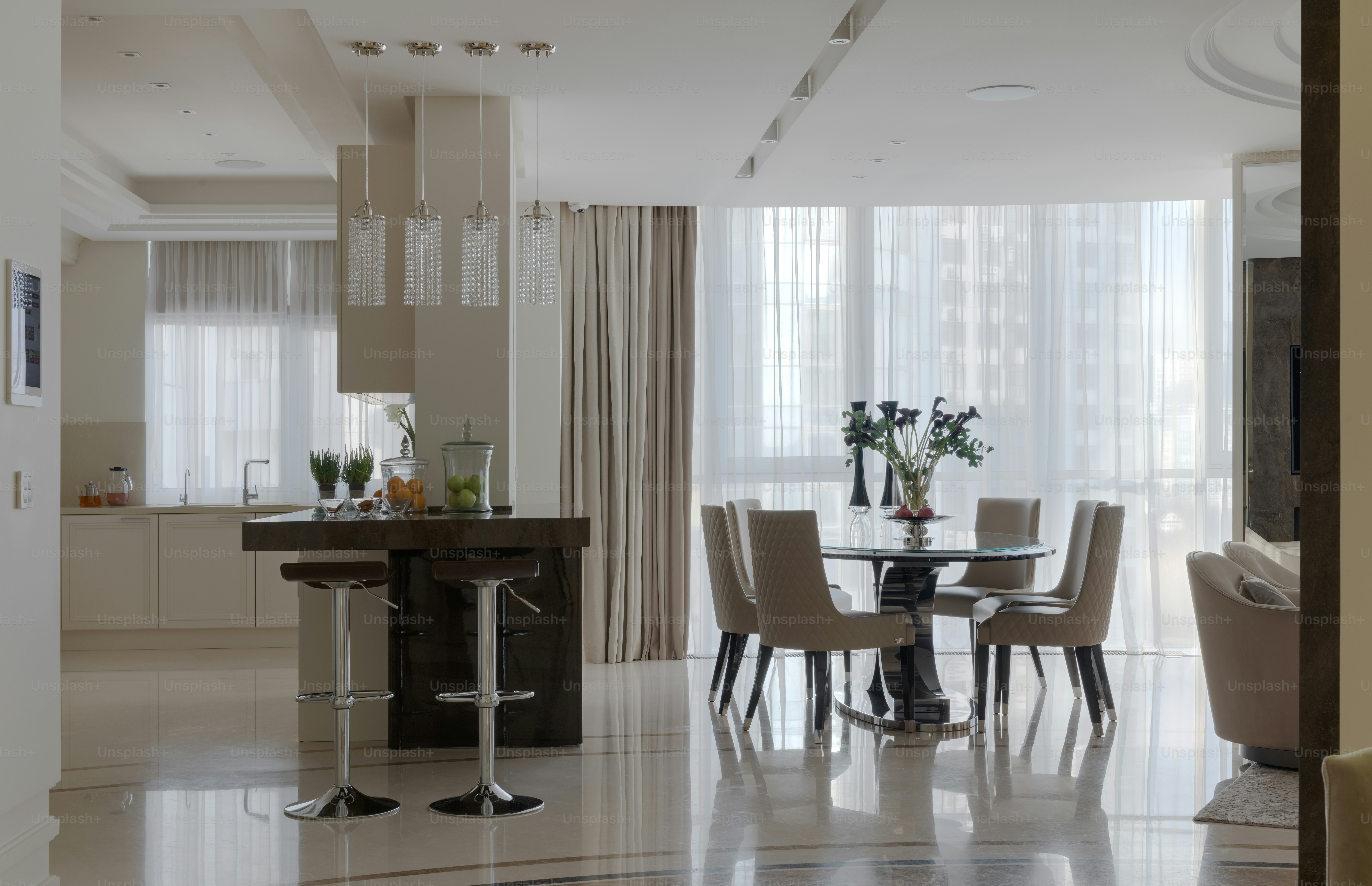 a dining room with a table and chairs