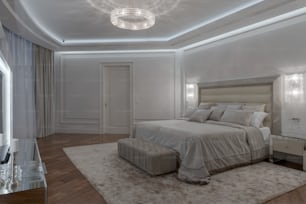 une chambre avec un grand lit et un lustre