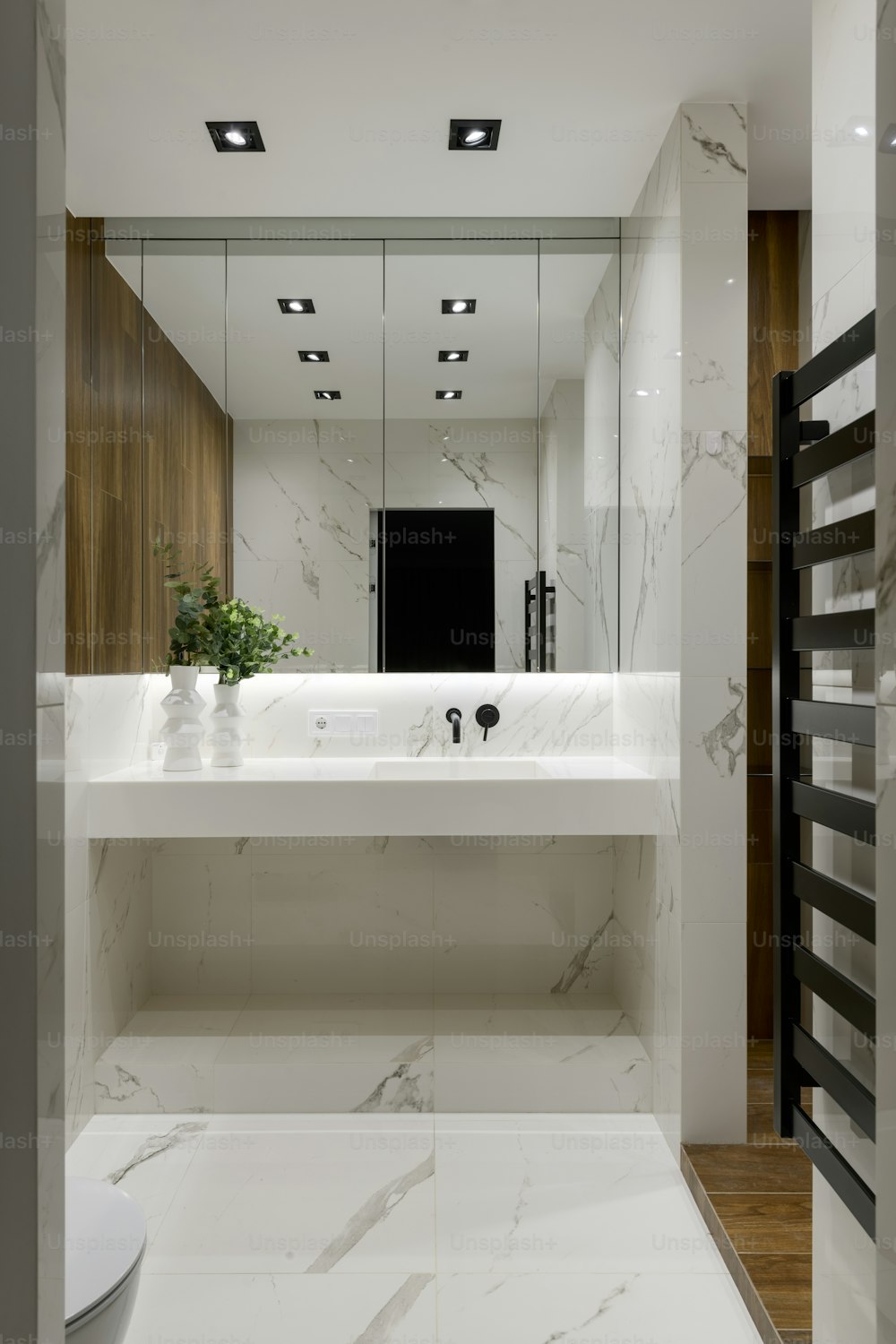 a bathroom with a large mirror and a sink