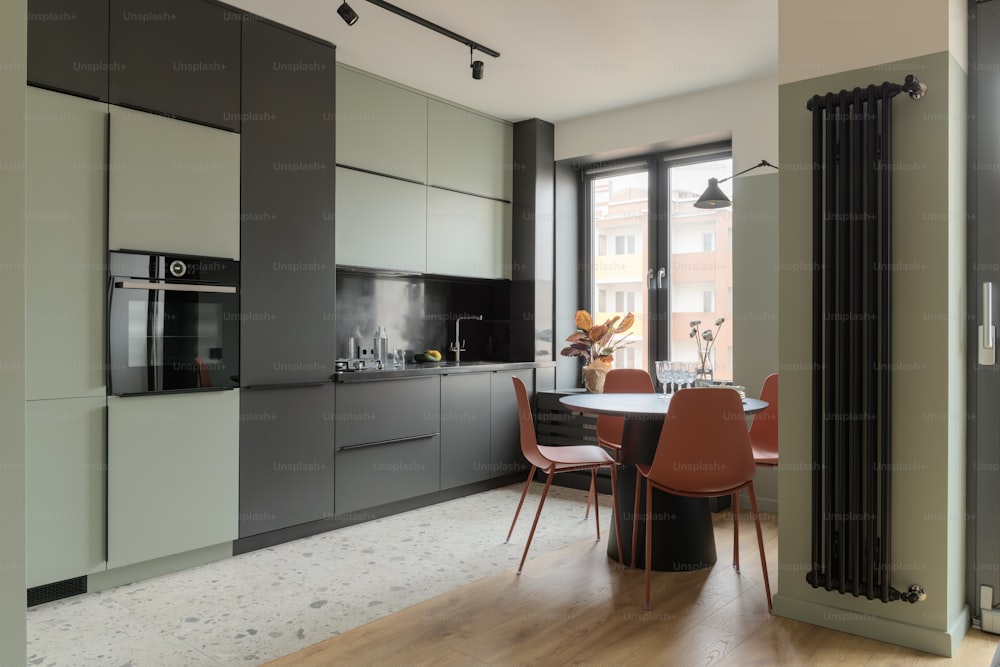 a kitchen with a table and chairs and a stove