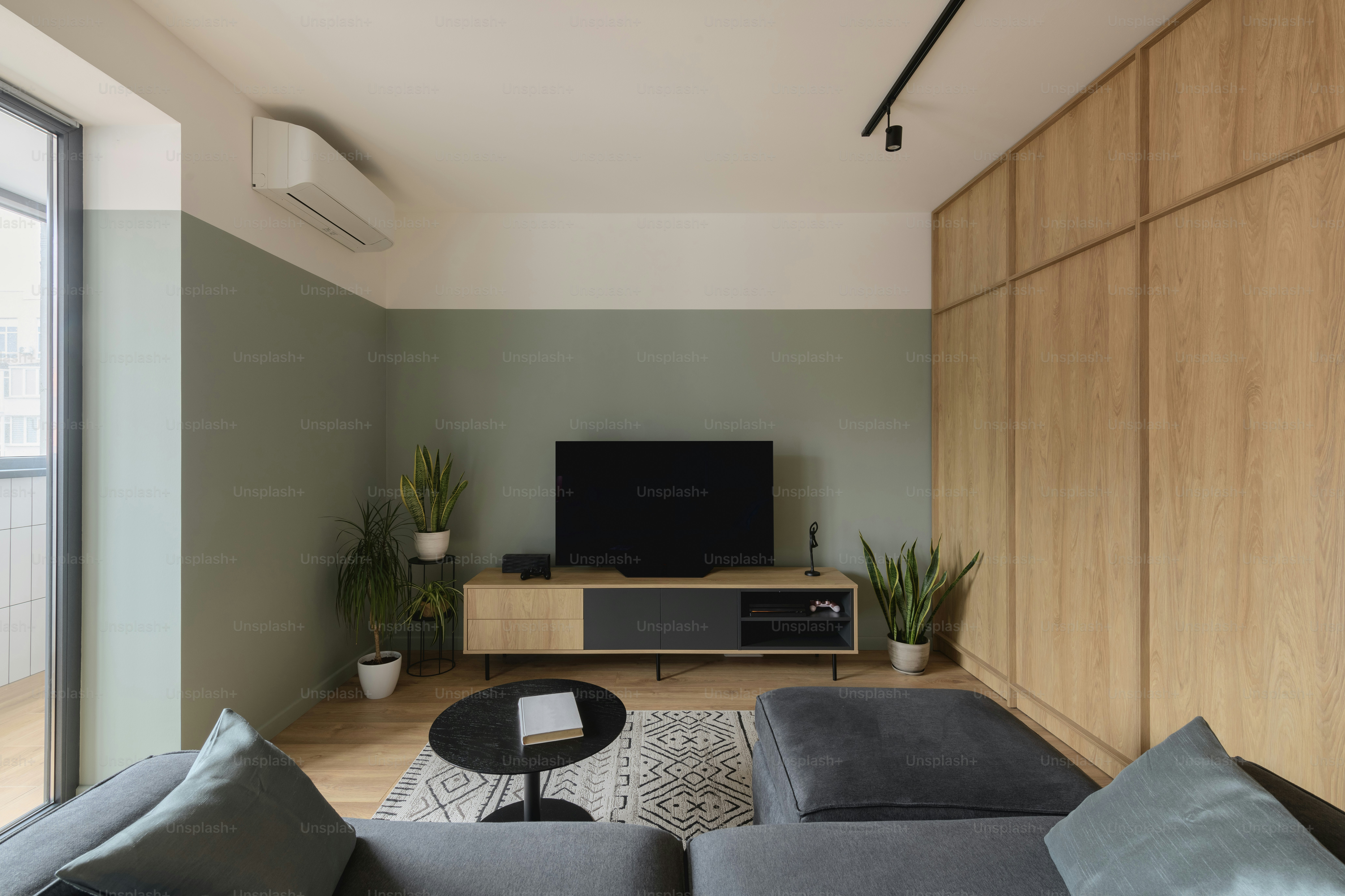 a living room with a couch a table and a tv