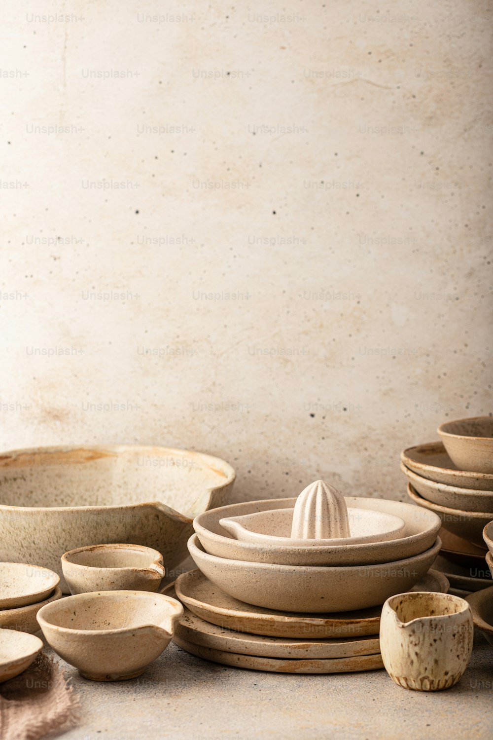 a table topped with lots of bowls and plates