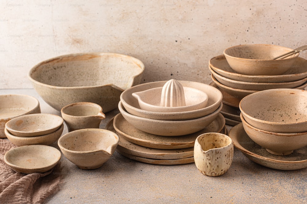 a pile of dirty dishes sitting on top of a table