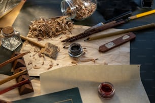 a pile of wood shavings and other items on a table