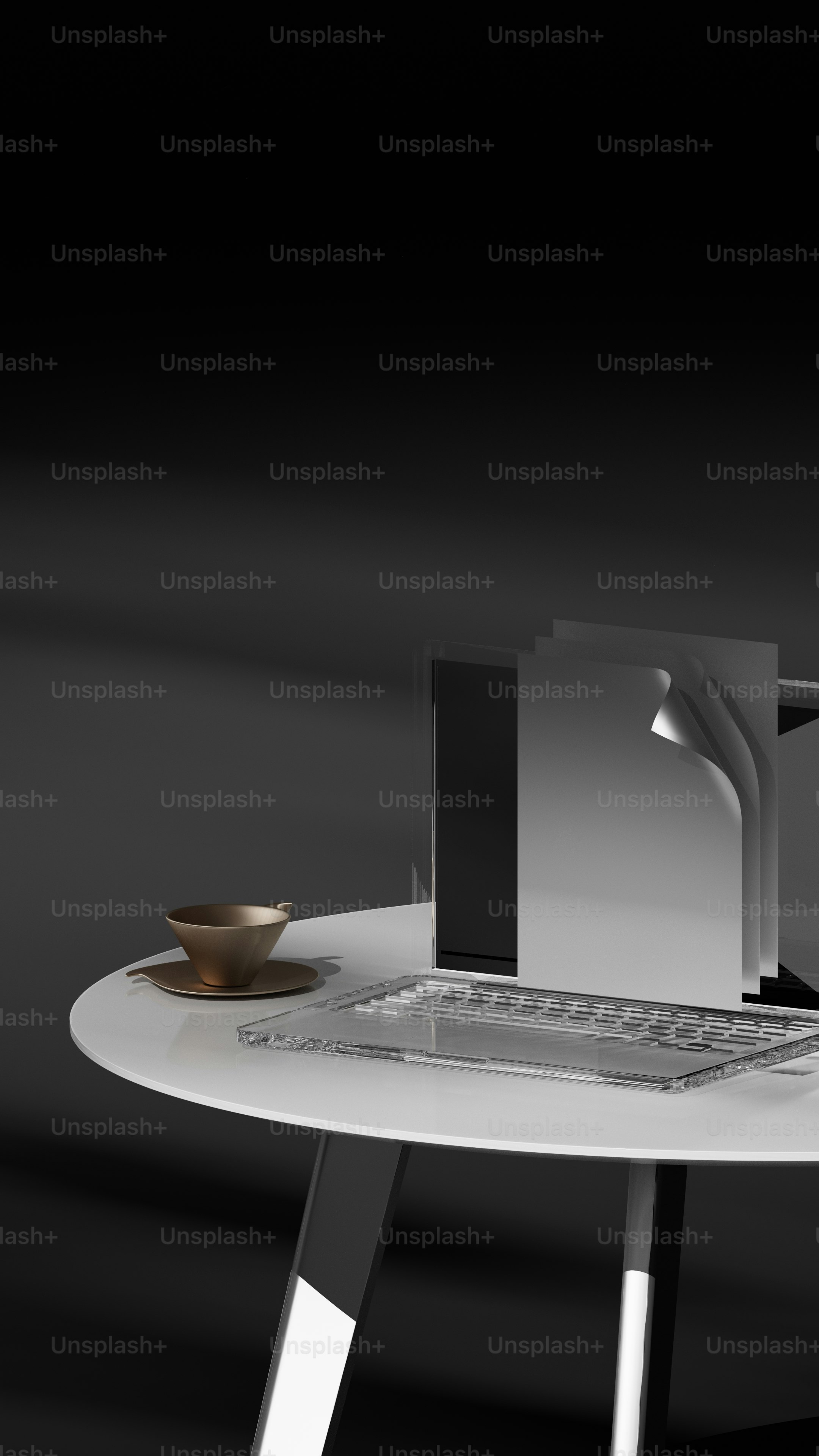 a laptop computer sitting on top of a white table