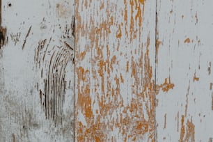 a close up of a wall with peeling paint