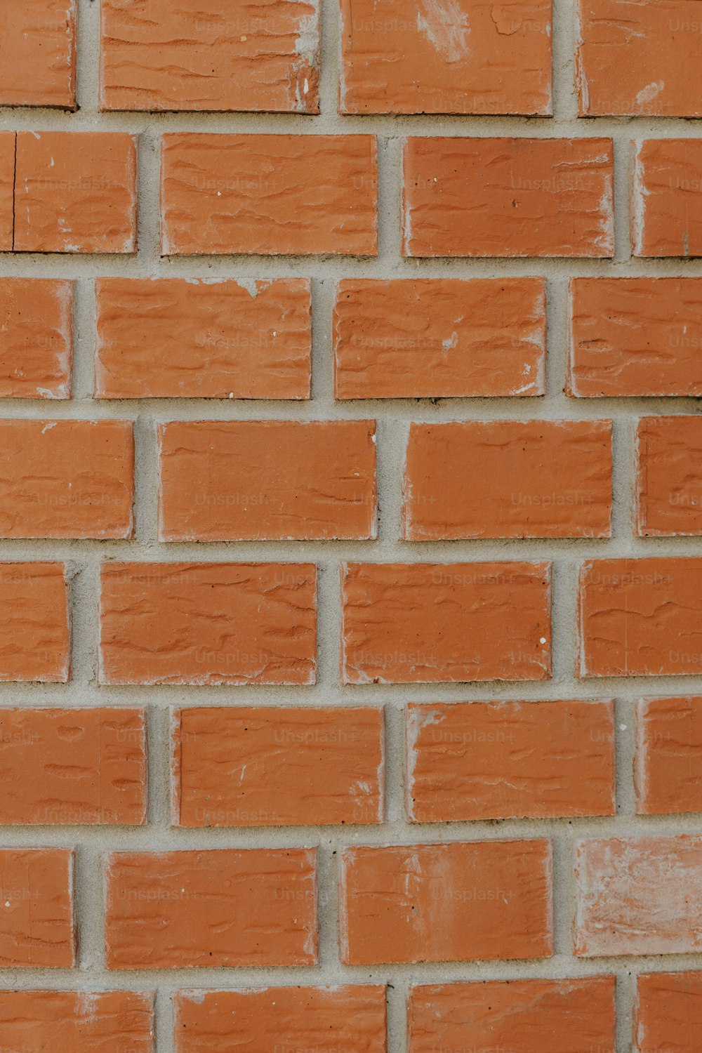 a close up of a red brick wall