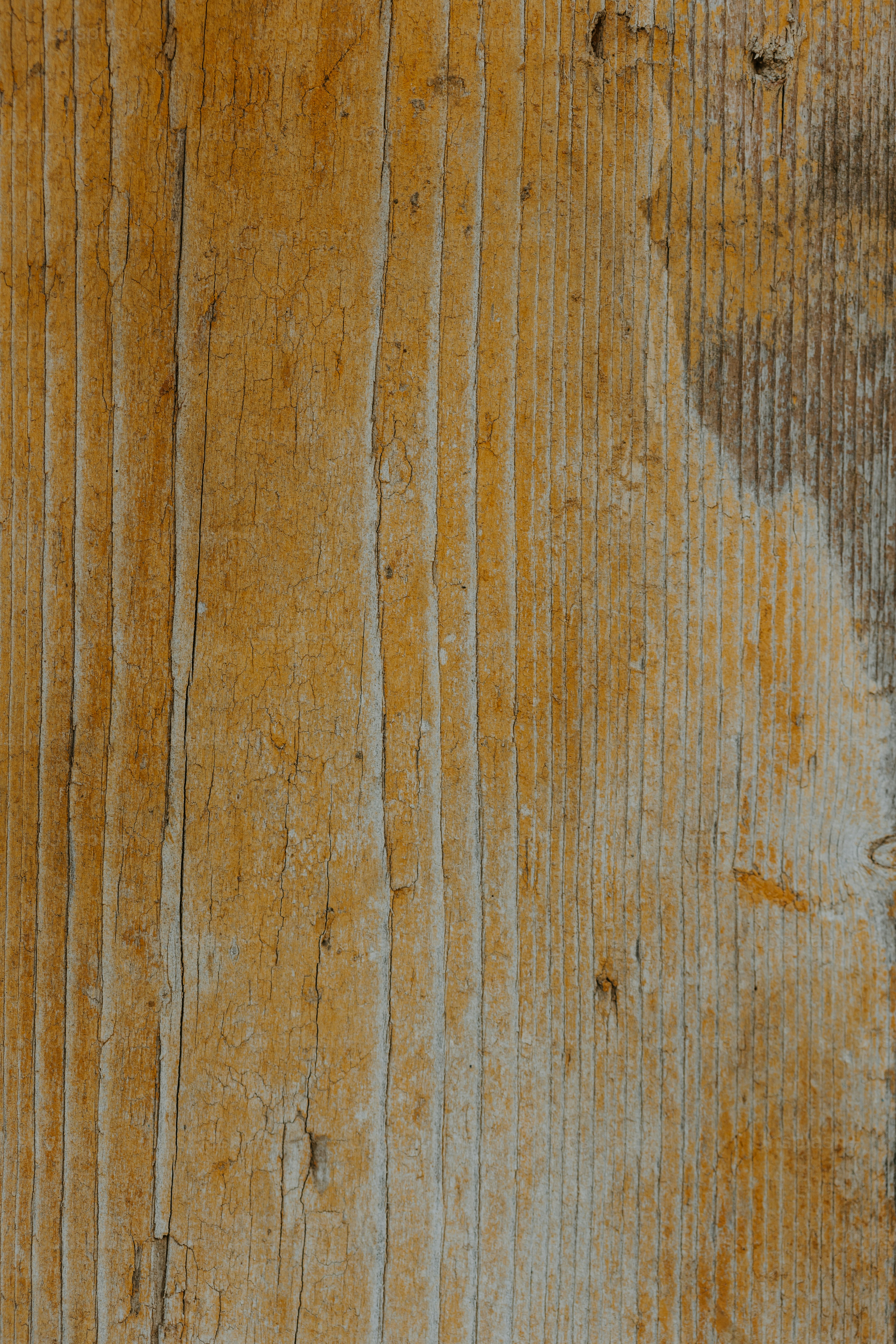 a close up of a wooden surface with peeling paint
