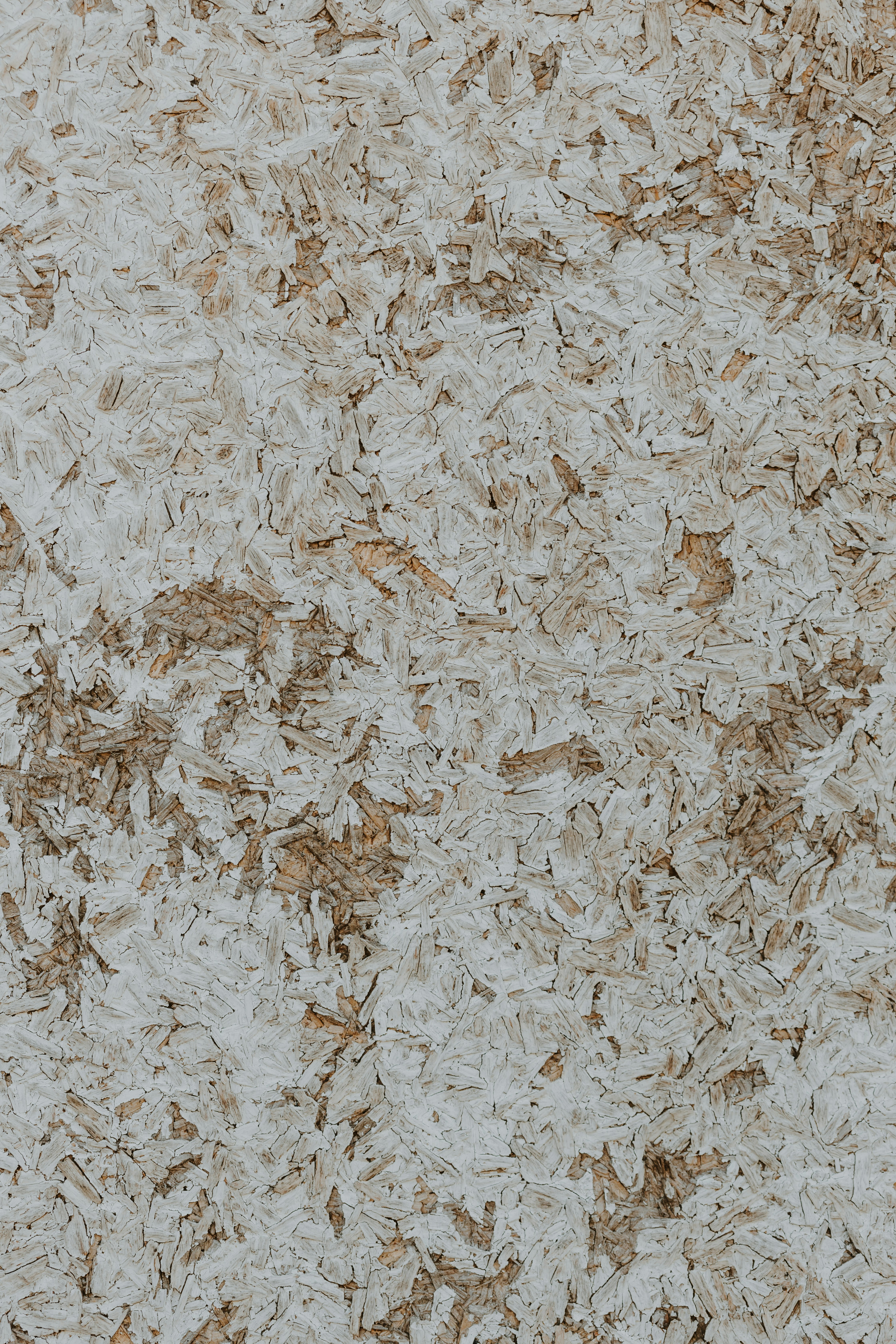 a close up of a white and brown wall