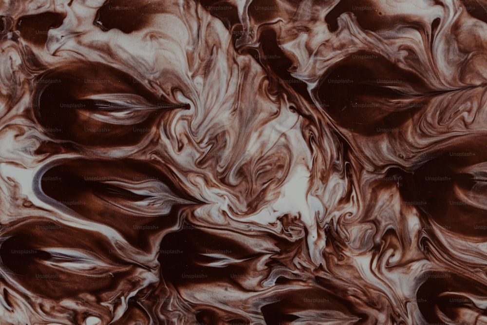 a close up of a brown and white marble
