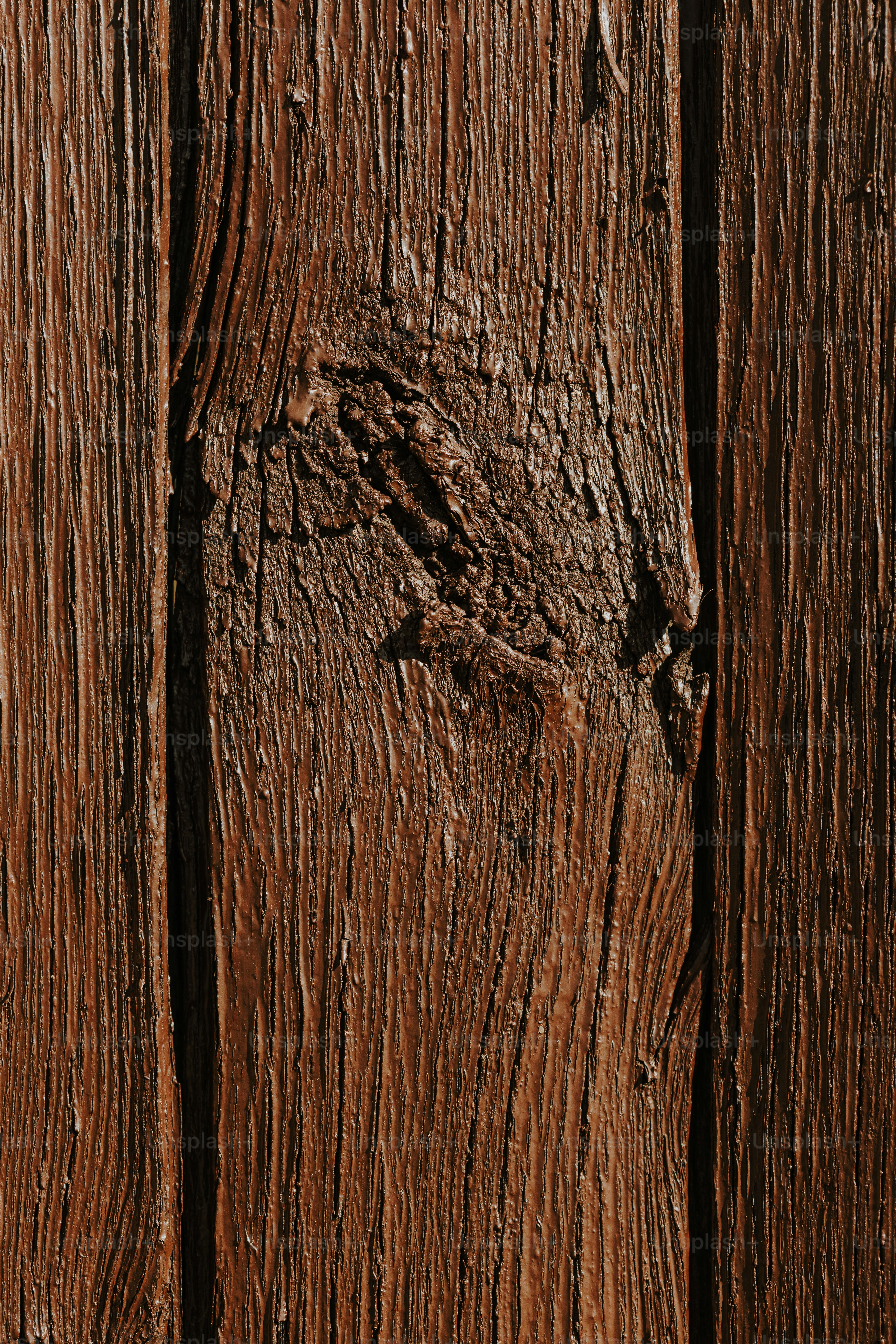 a close up of a wooden surface with peeling paint