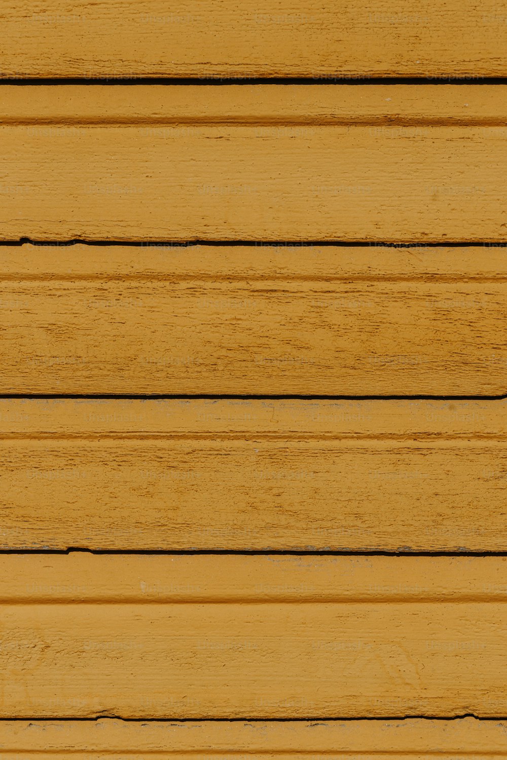 a close up of a wooden planks with a red stop sign on it