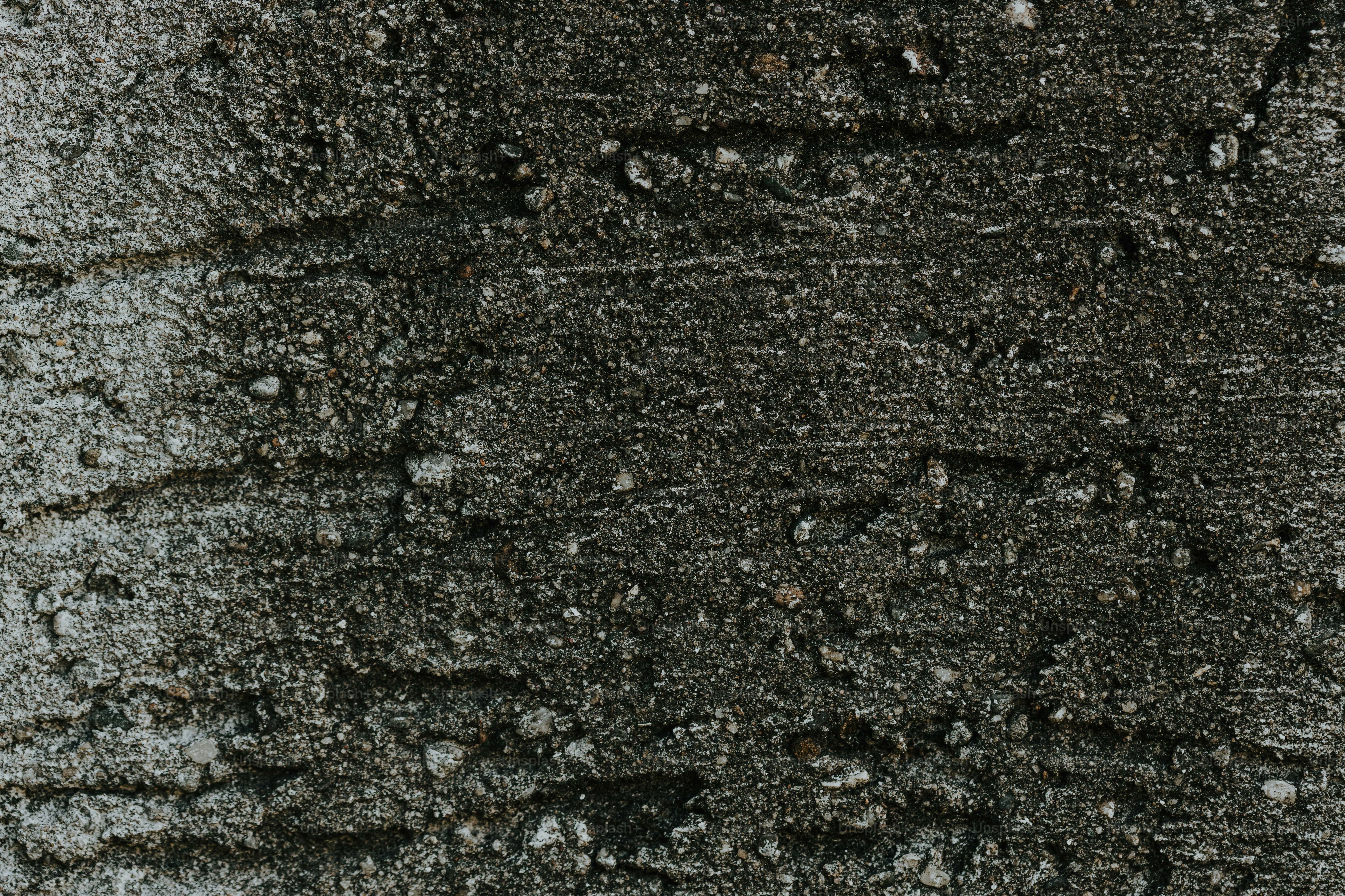 a close up of a dirt surface with small rocks