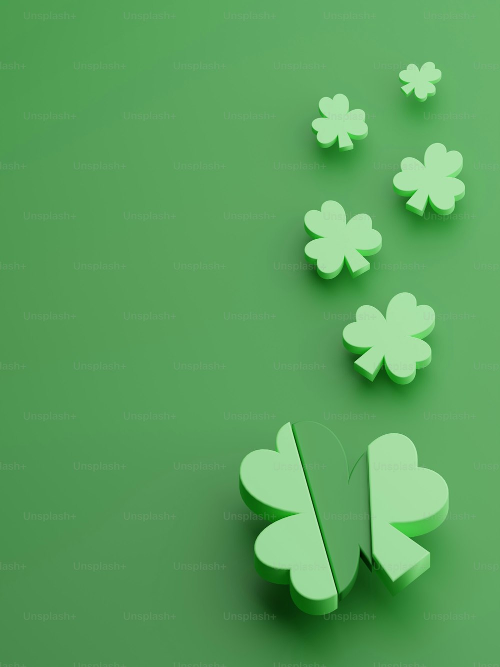 a group of green shamrocks on a green background
