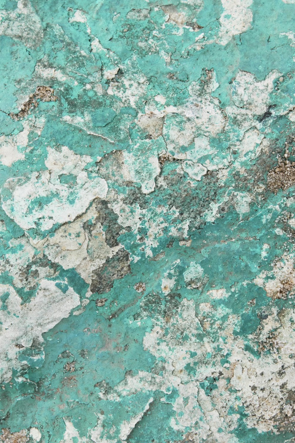a close up of a green and white marble surface