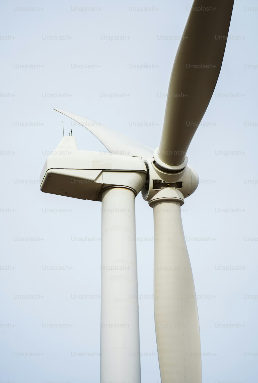 a close up of a wind turbine on a clear day