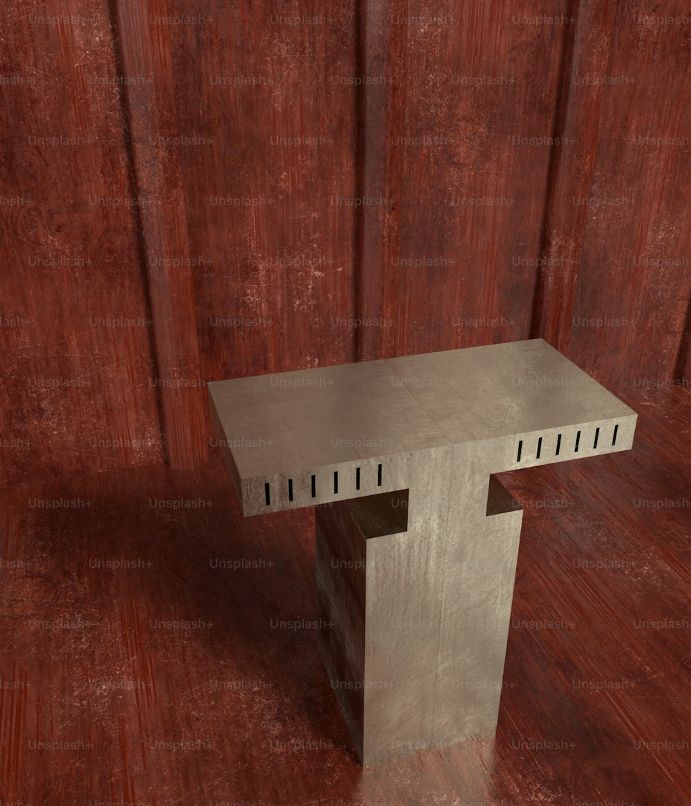 une table en métal posée sur un plancher en bois