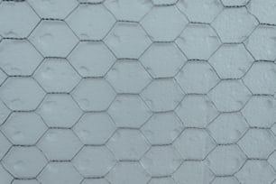 a close up of a white wall with a hexagonal pattern