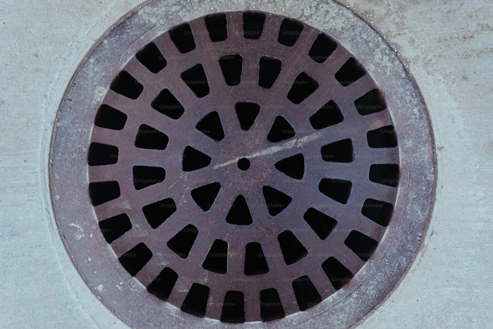 a manhole cover on the side of a building
