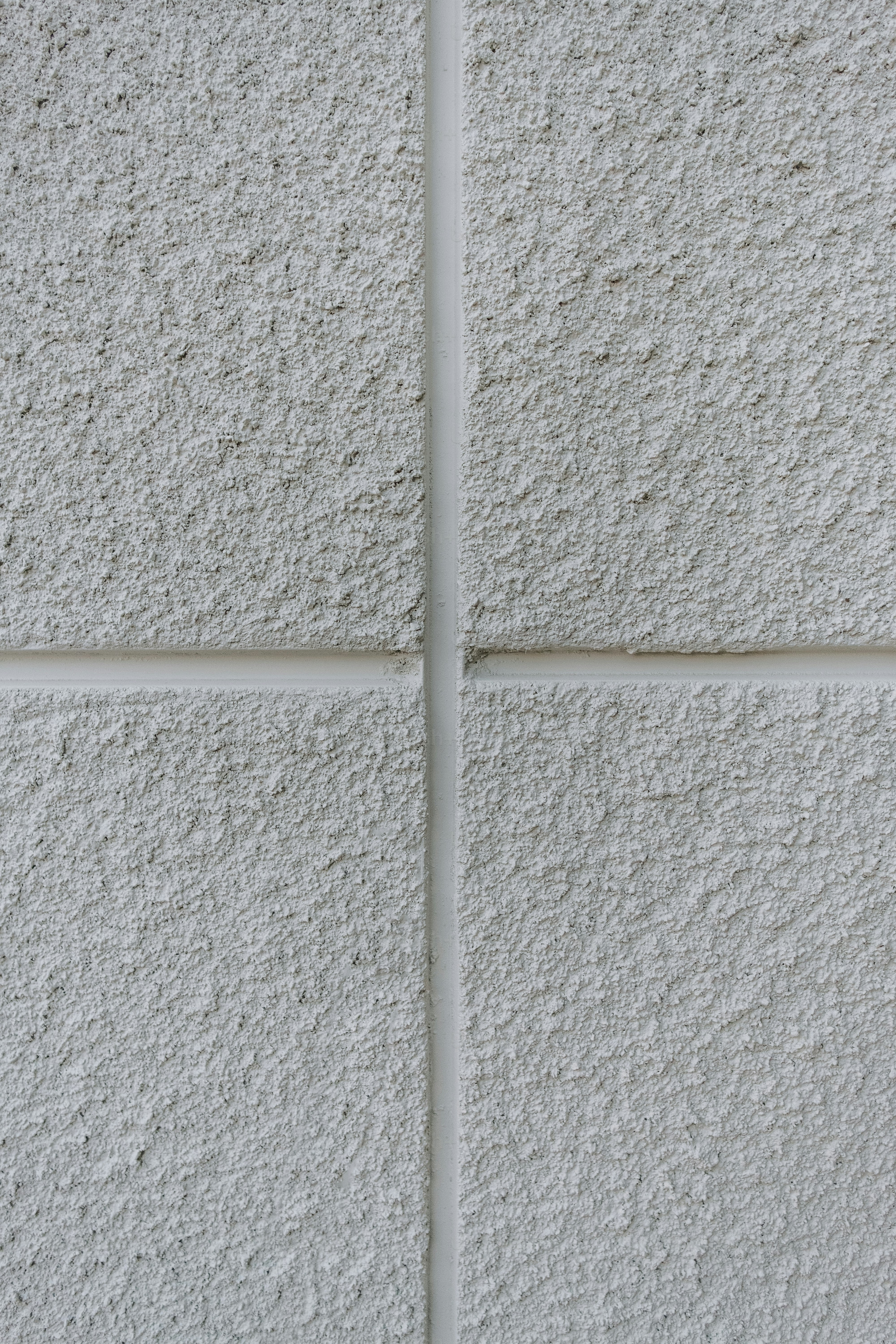a close up of a white brick wall