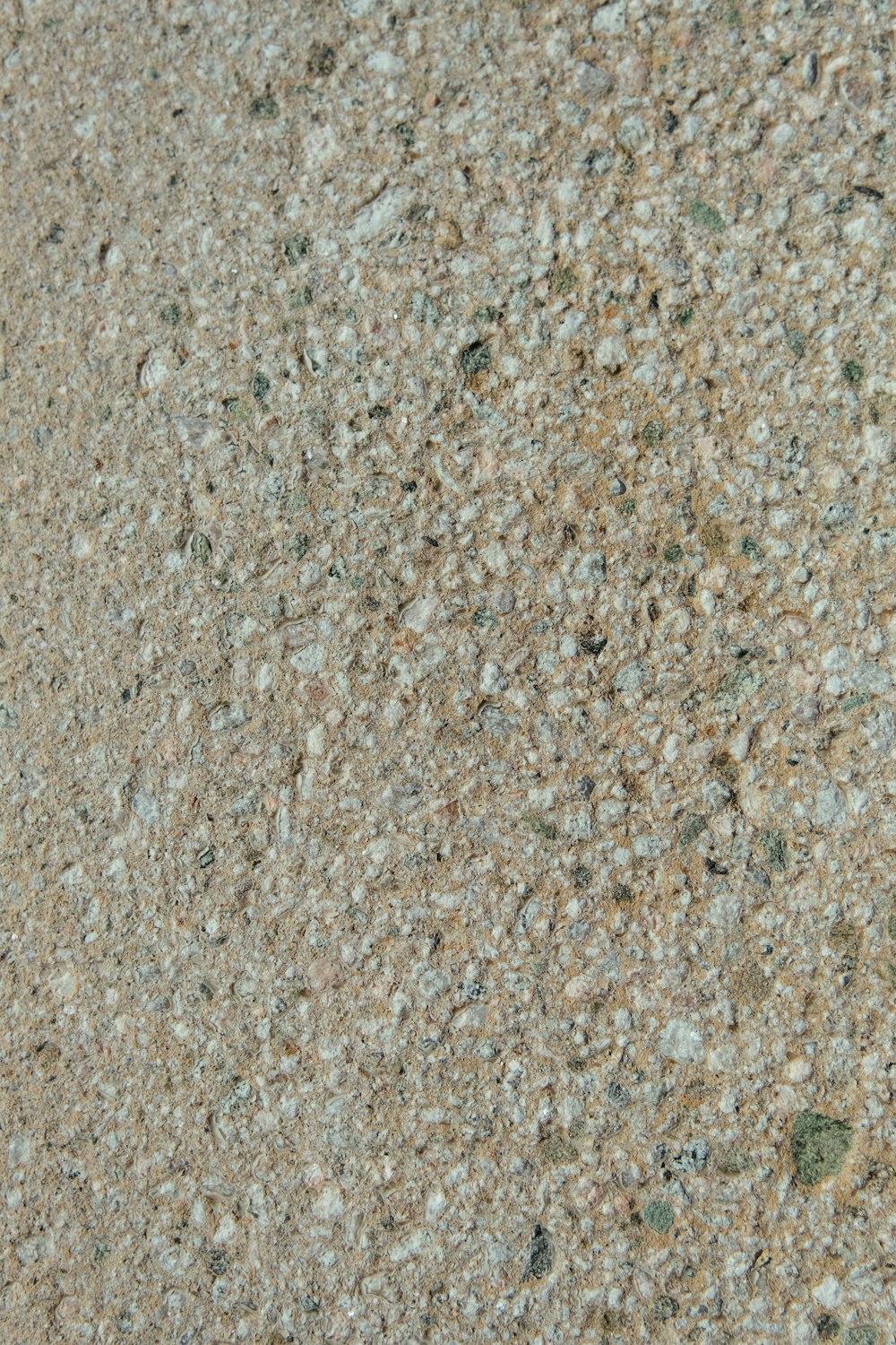 a close up of a stone surface with small rocks