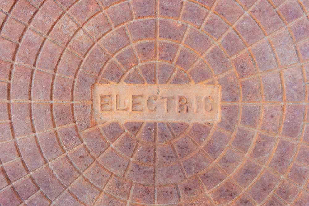 a close up of a brick wall with a sign on it