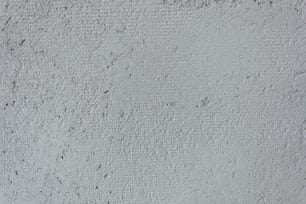 a close up of a white stucco wall