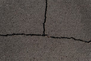 a close up of a crack in the asphalt