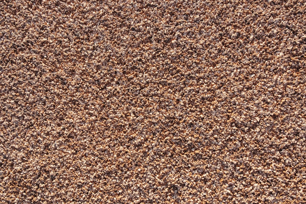 un primo piano di una trama di tappeto marrone