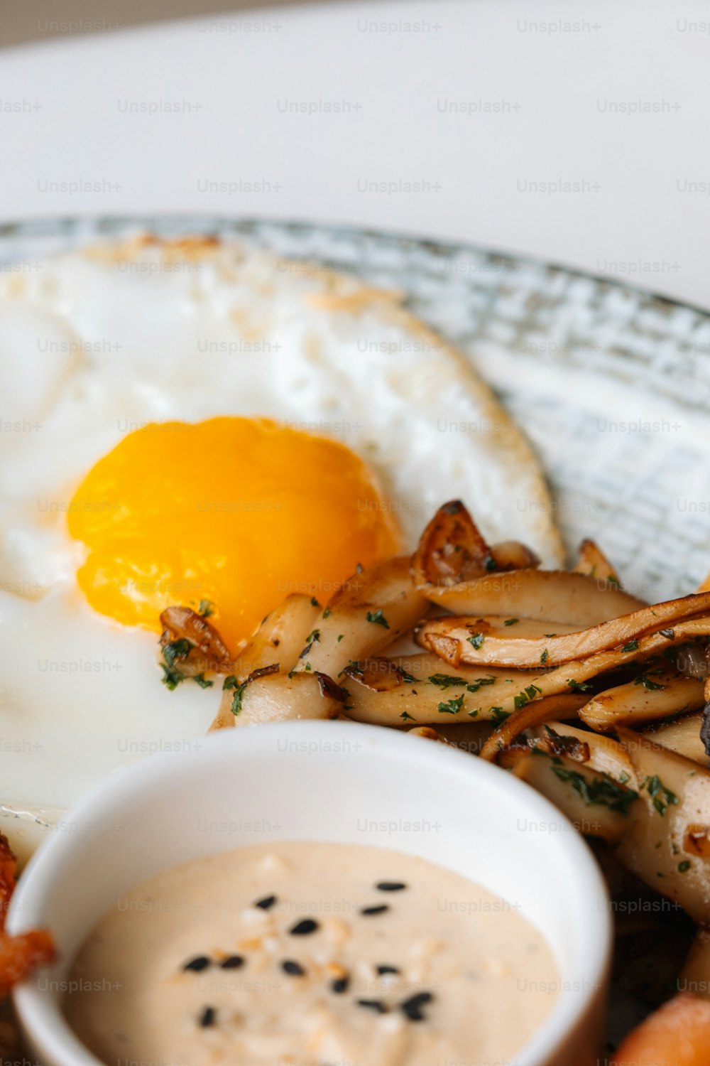 a plate of food with a fried egg and fries