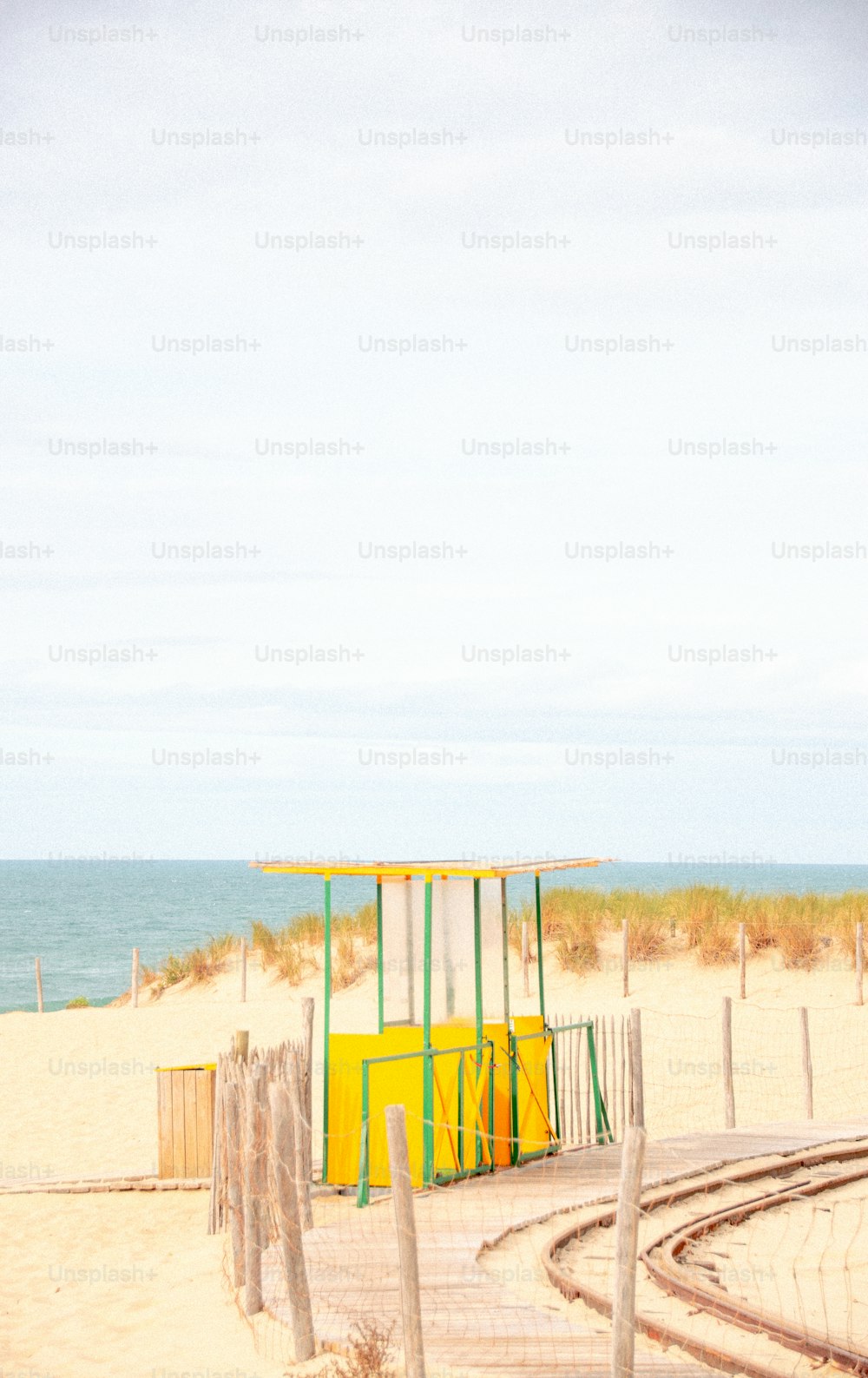 a lifeguard station on a beach near the ocean