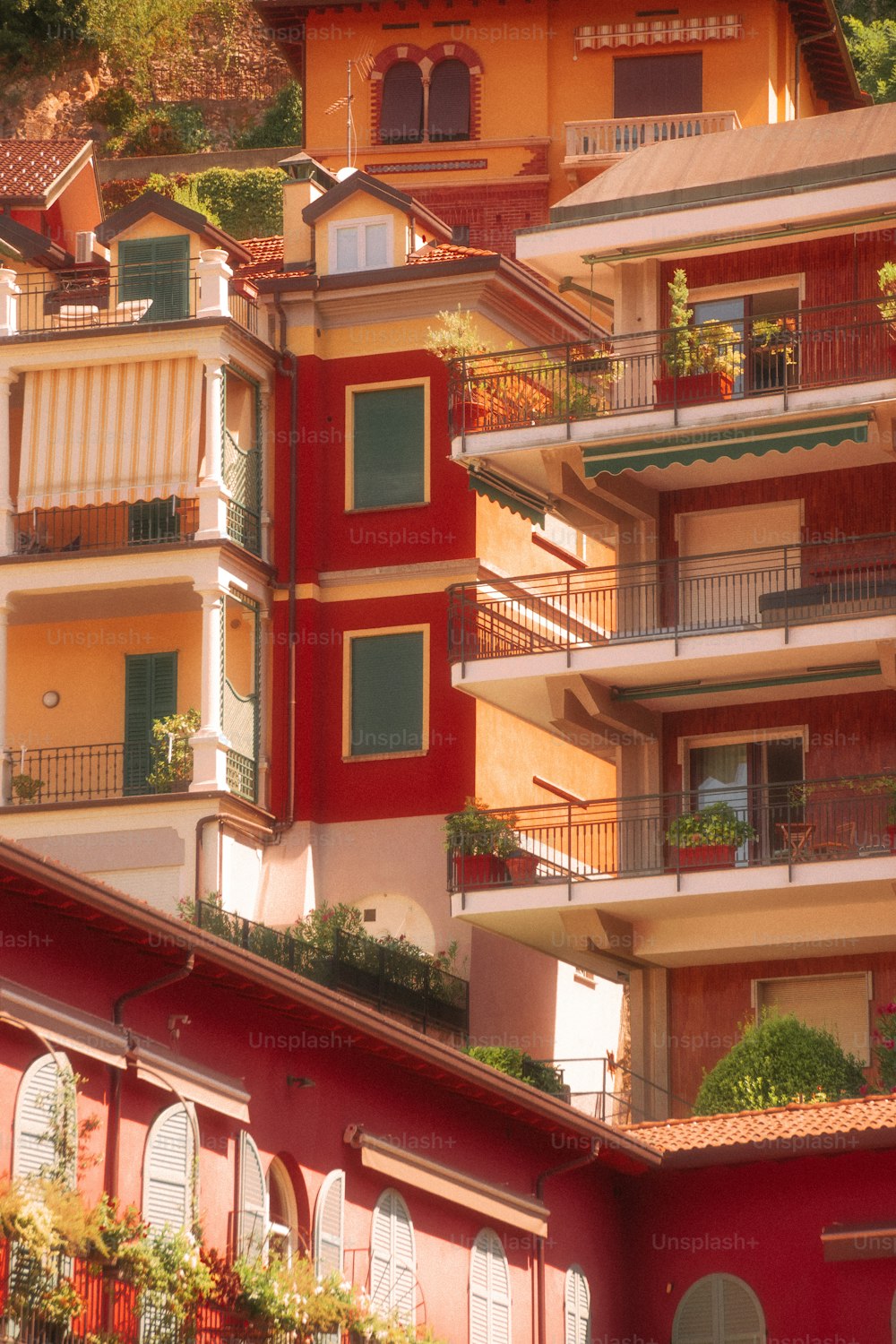 a red building with balconies and balconies on the top of it