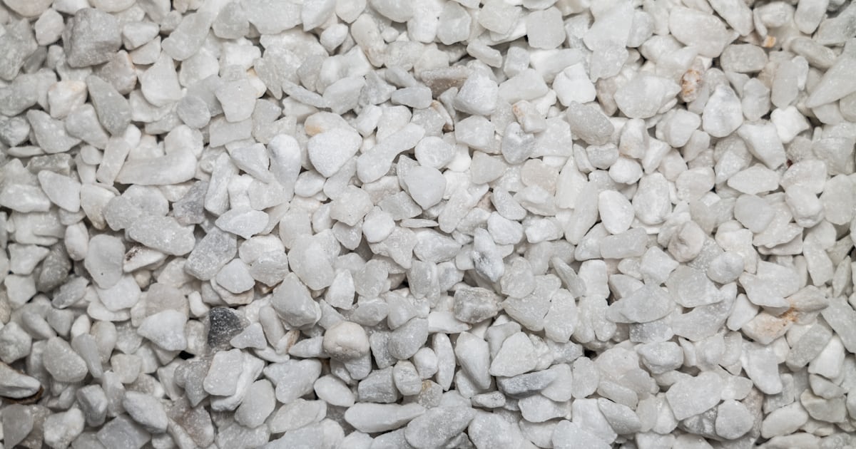 A pile of white rocks sitting next to each other photo – Gravel Image ...