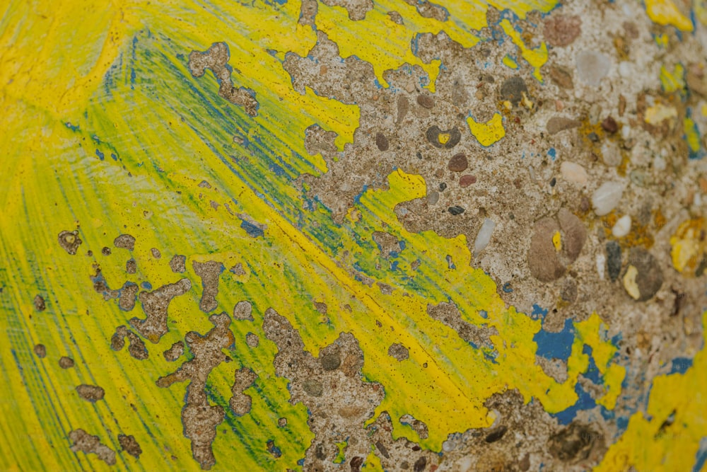 a close up of a yellow and blue painting