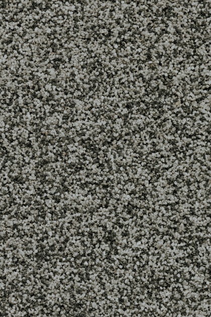 Close-up of commercial gray carpet fiber, representing substrates tested in the CRI evaluation for the Mastercraft® SV280P
