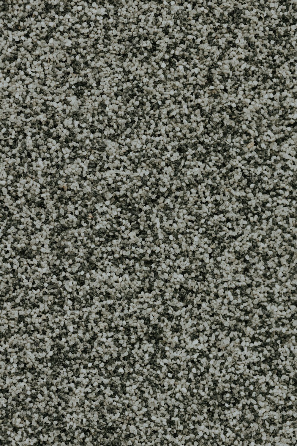 Eine Nahaufnahme einer grauen Teppichstruktur