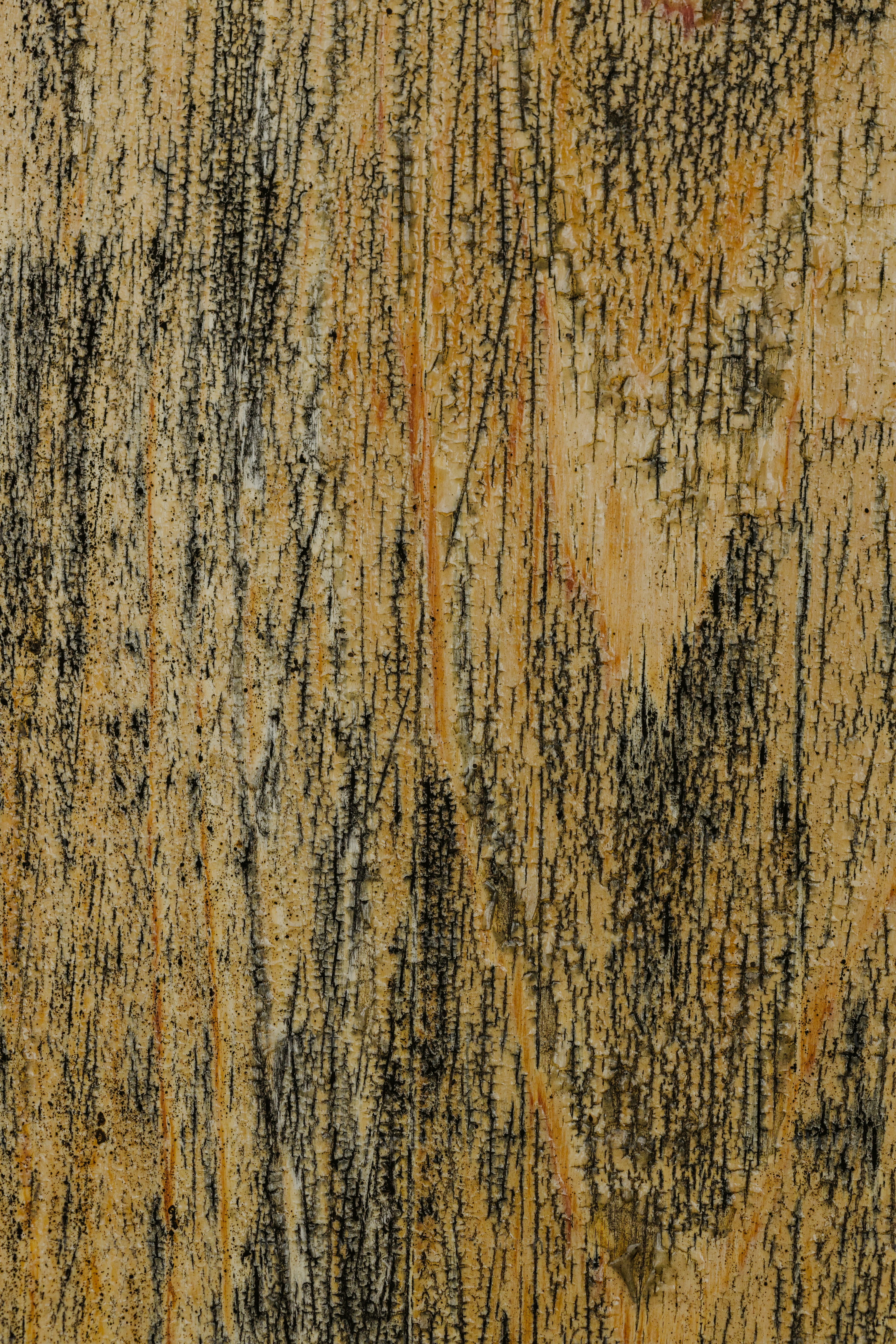 Nahaufnahme einer Wand mit schwarz-gelber Farbe