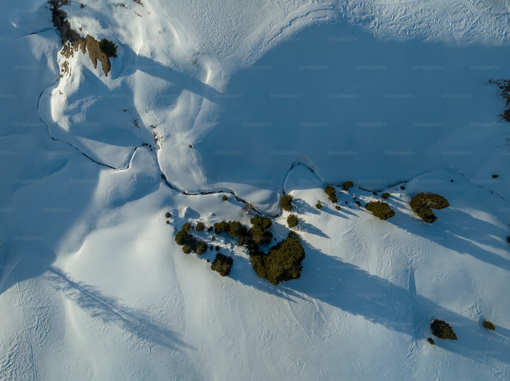 an aerial view of a snow covered mountain