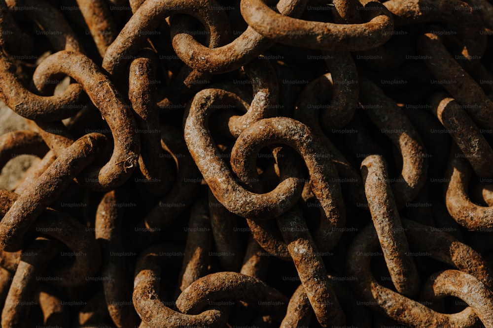 a pile of rusty chains sitting next to each other