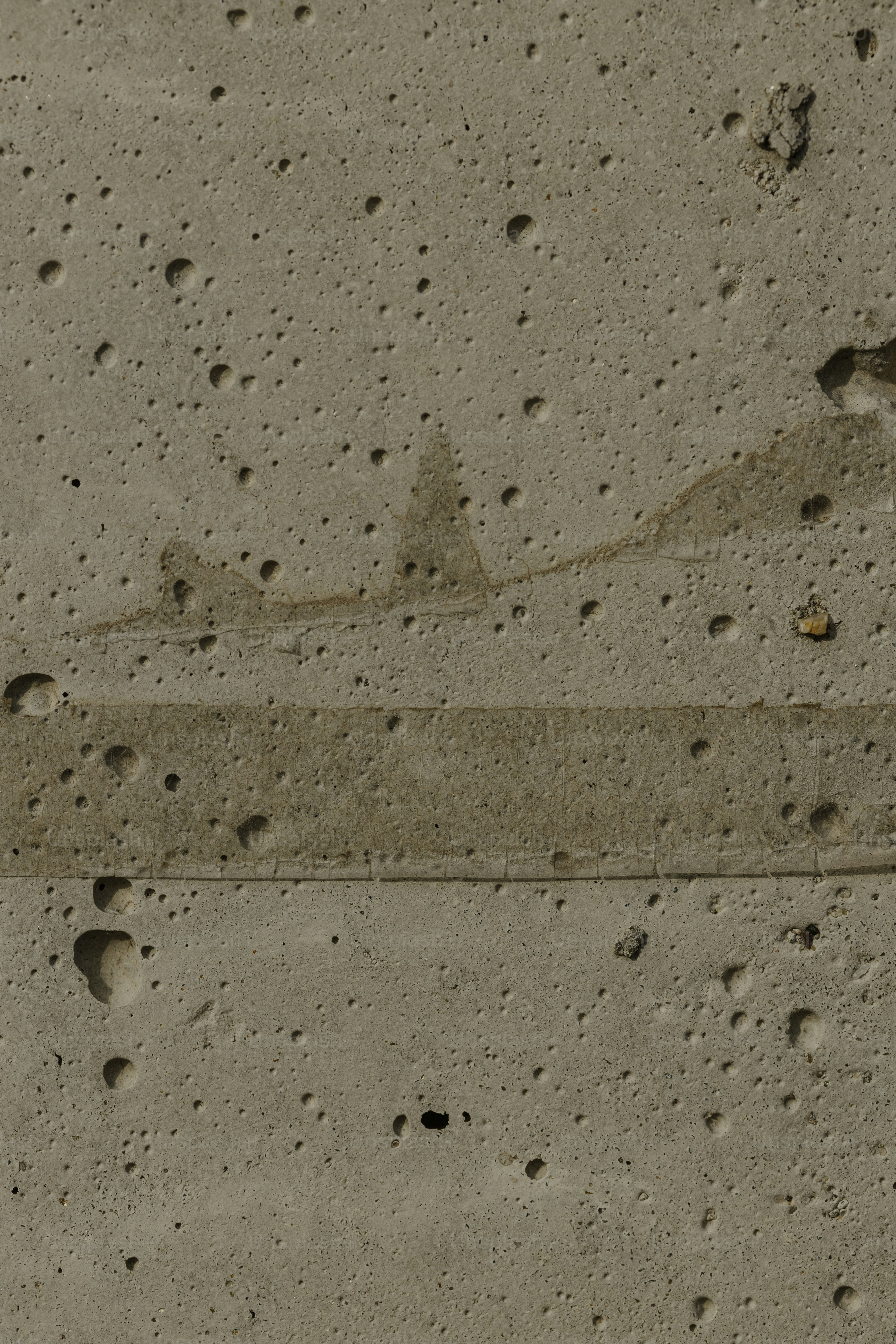 a close up of a street sign on a cement surface