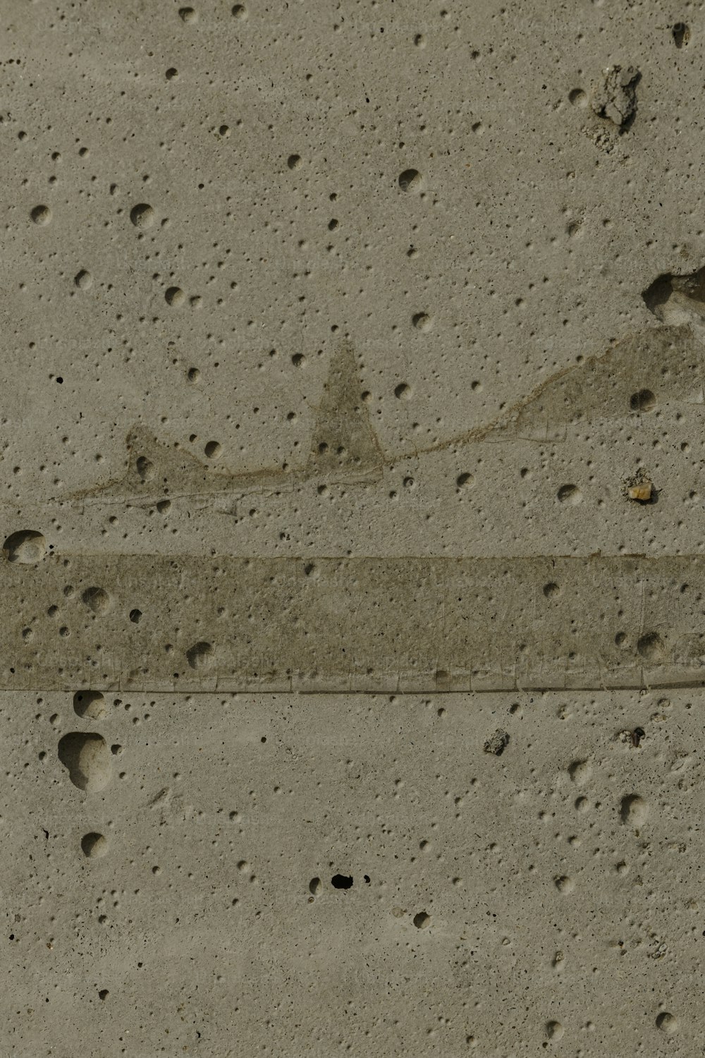 a close up of a street sign on a cement surface