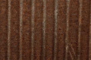 a close up of a metal sheet with rust on it