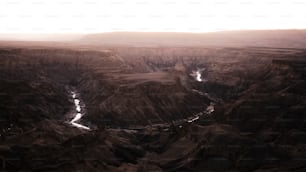 a view of a canyon with a river running through it