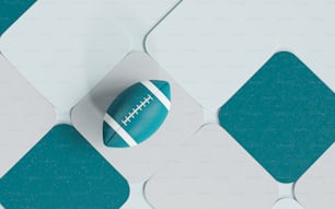 a football sitting on top of a blue and white tile