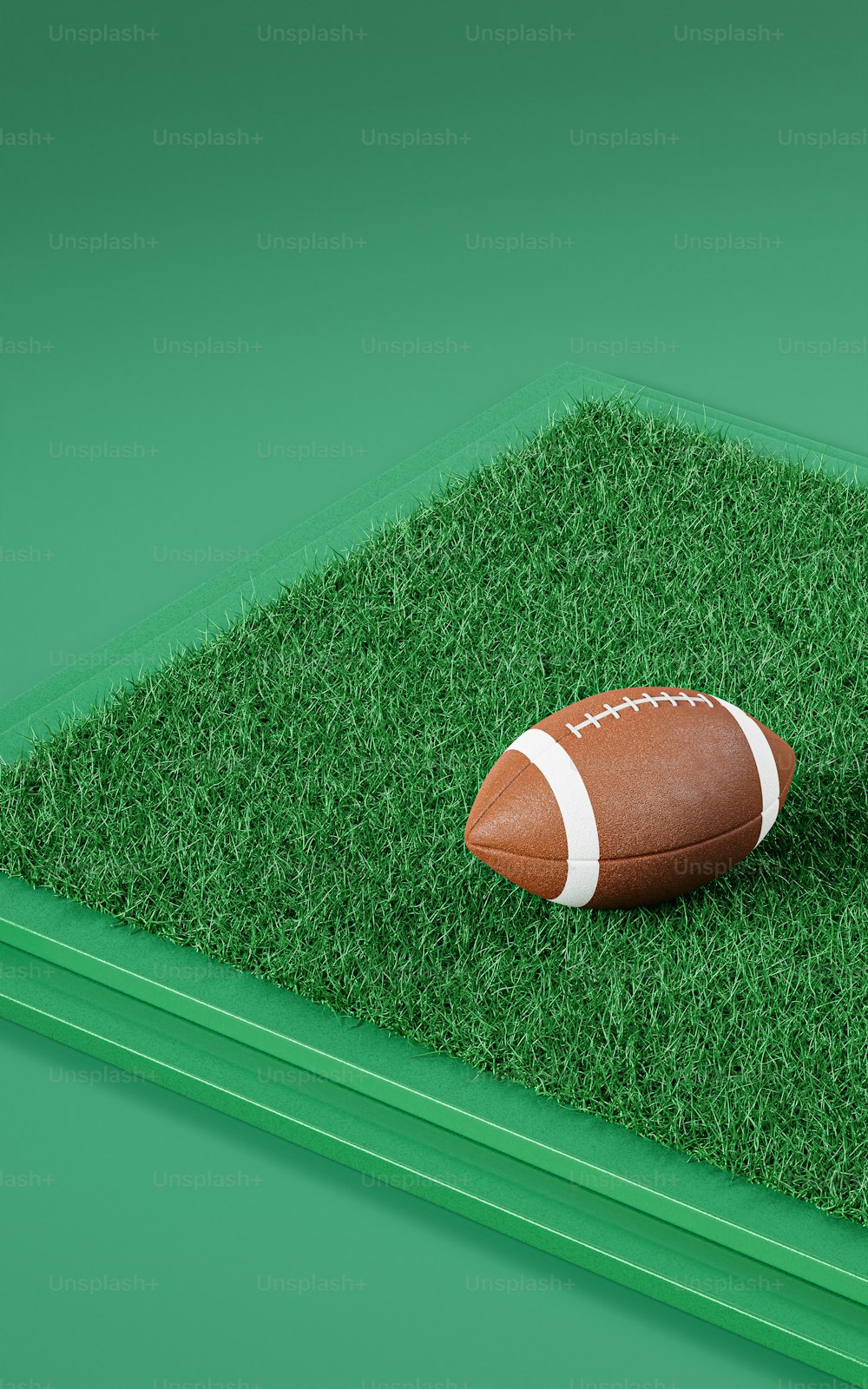 un ballon de football assis au sommet d’un terrain vert