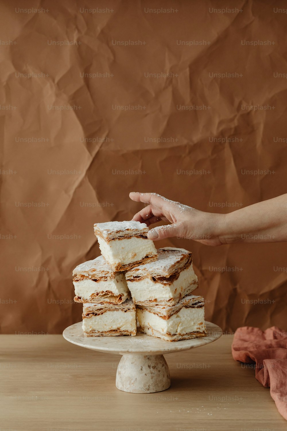 a stack of cake sitting on top of a white plate