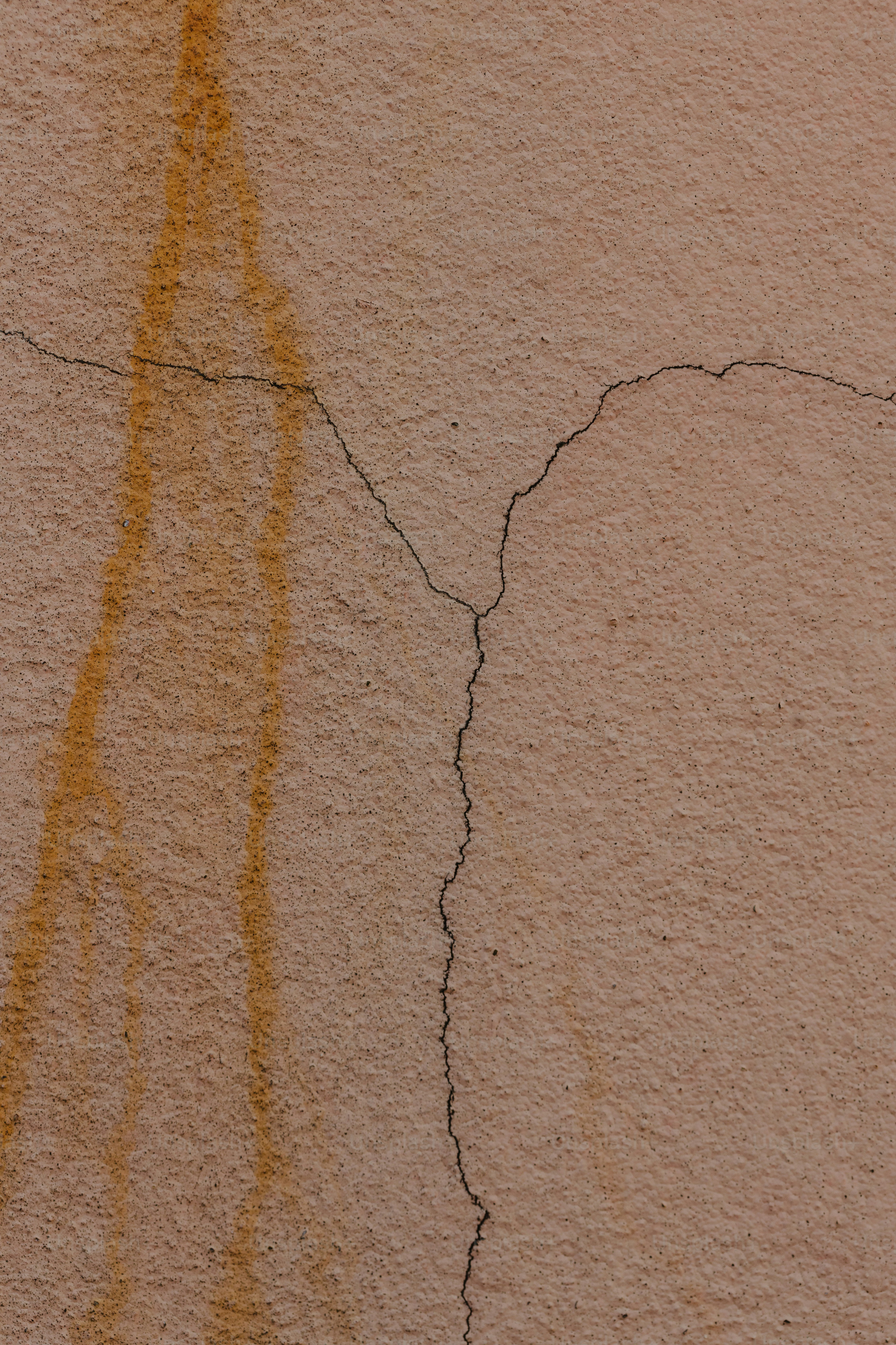 a close up of a wall with a crack in it