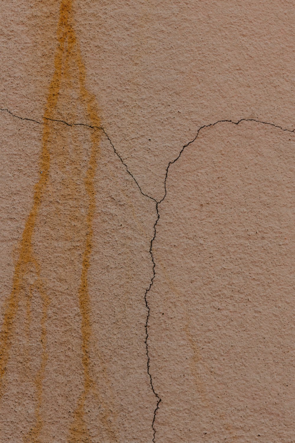 a close up of a wall with a crack in it
