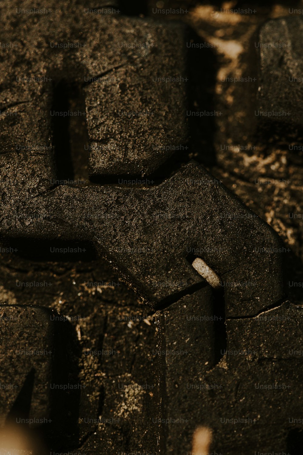 a close up of a piece of black rocks