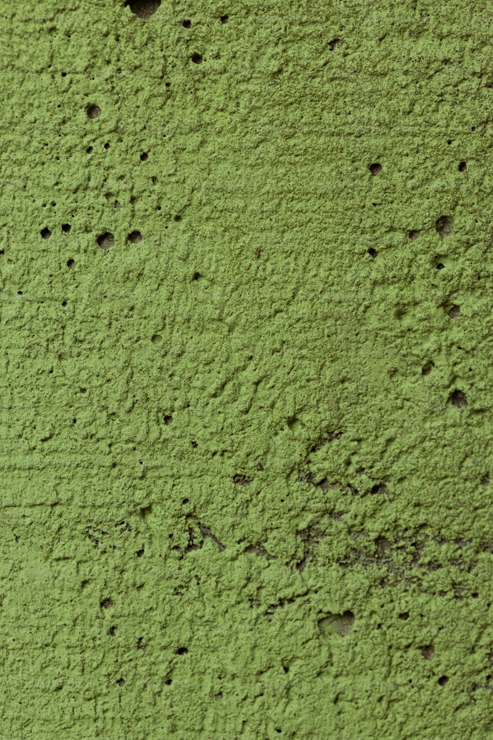 Nahaufnahme einer Wand mit grüner Farbe